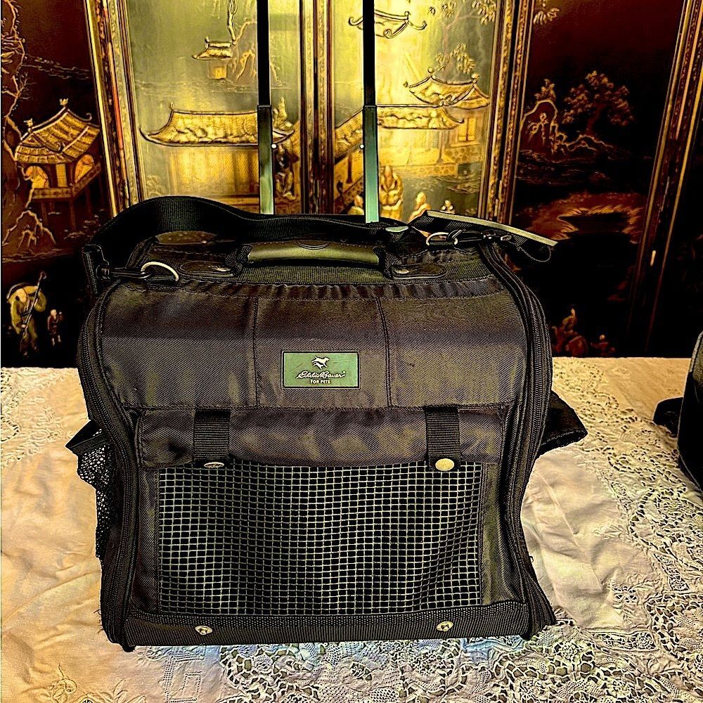 Eddie Bauer black expandable handle, rolling small pet carrier. ￼